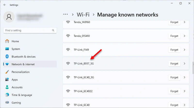 Selecting a Wi-Fi network from the list of known networks to view the password